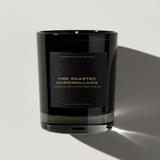 Black candle with 'Fire Roasted Marshmallows' label on a light gray background