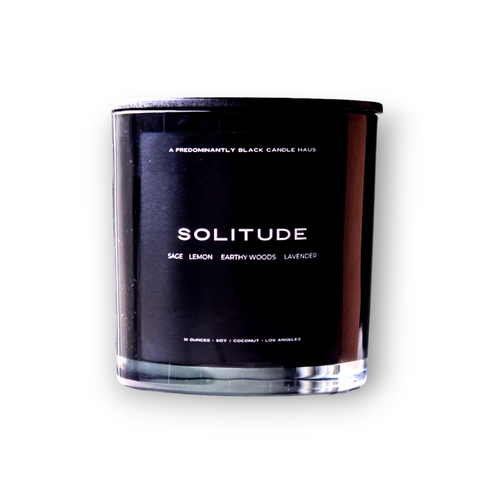 A sleek predominantly black SOLITUDE CANDLE labeled "solitude" with notes of sage, lemon, earthy woods, and lavender, presented against a clean white background.