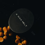 Core Collection Wax Melt Gift Set: black scented wax melt tin styled with orange wax pieces — Predominantly Black