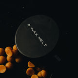 Core Collection Wax Melt Gift Set: black scented wax melt tin styled with orange wax pieces — Predominantly Black