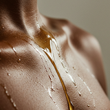 Moisturizing body oil dripping over a shoulder — Predominantly Black