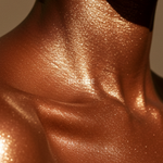 Sun Glaze Shimmer Body Oil: bronze shimmer oil on shoulders and chest — Predominantly Black