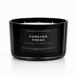 FOREVER FRESH soy-coconut scented candle in a wide black vessel; lemon and clean linen fragrance — Predominantly Black