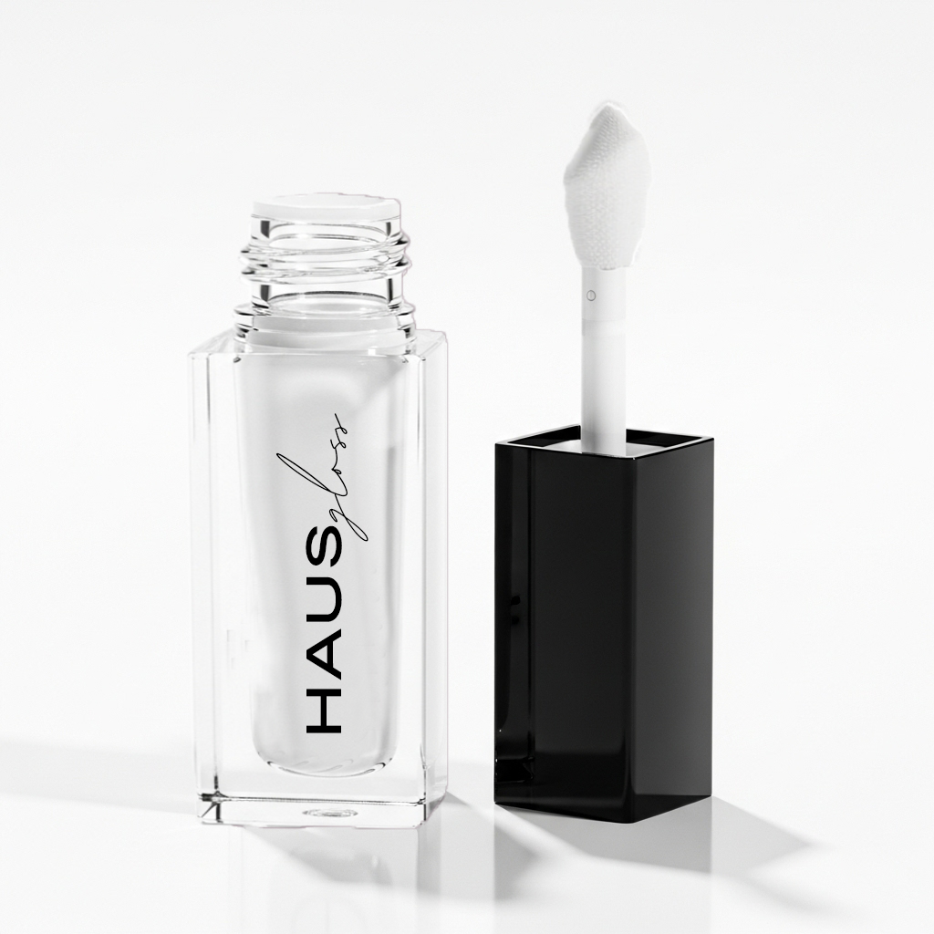 HAUS GLOSS bottle with applicator beside black cap — Predominantly Black
