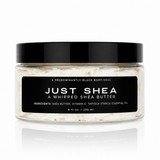 JUST SHEA whipped shea body butter in a clear jar with a black lid — Predominantly Black