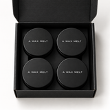 Core Collection Wax Melt Gift Set: open black wax melt gift box showing four visible tins — Predominantly Black