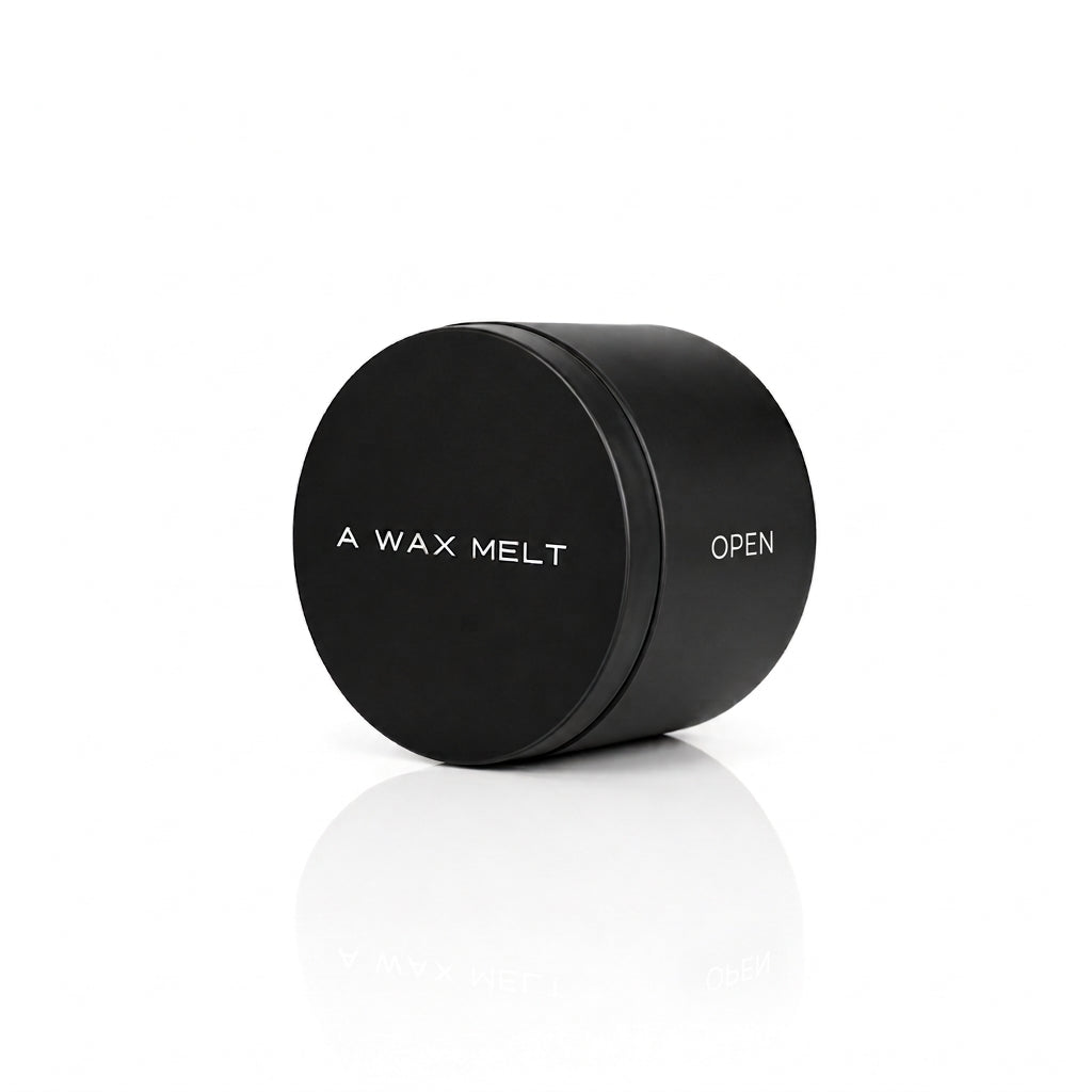 OPEN wax melt in a closed black tin; sea salt and jasmine fragrance — Predominantly Black