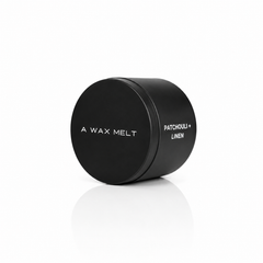 PATCHOULI + LINEN wax melt in a closed black tin; patchouli and linen fragrance — Predominantly Black