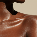 Sun Glaze Shimmer Body Oil: pearl shimmer oil finish on shoulders and chest — Predominantly Black