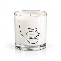 SOLITUDE soy-coconut scented candle in clear glass with a face illustration on a white background; sage and lavender fragrance — Predominantly Black
