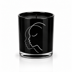 SUBTLE soy-coconut scented candle in black glass with a face illustration; coconut and vanilla fragrance — Predominantly Black