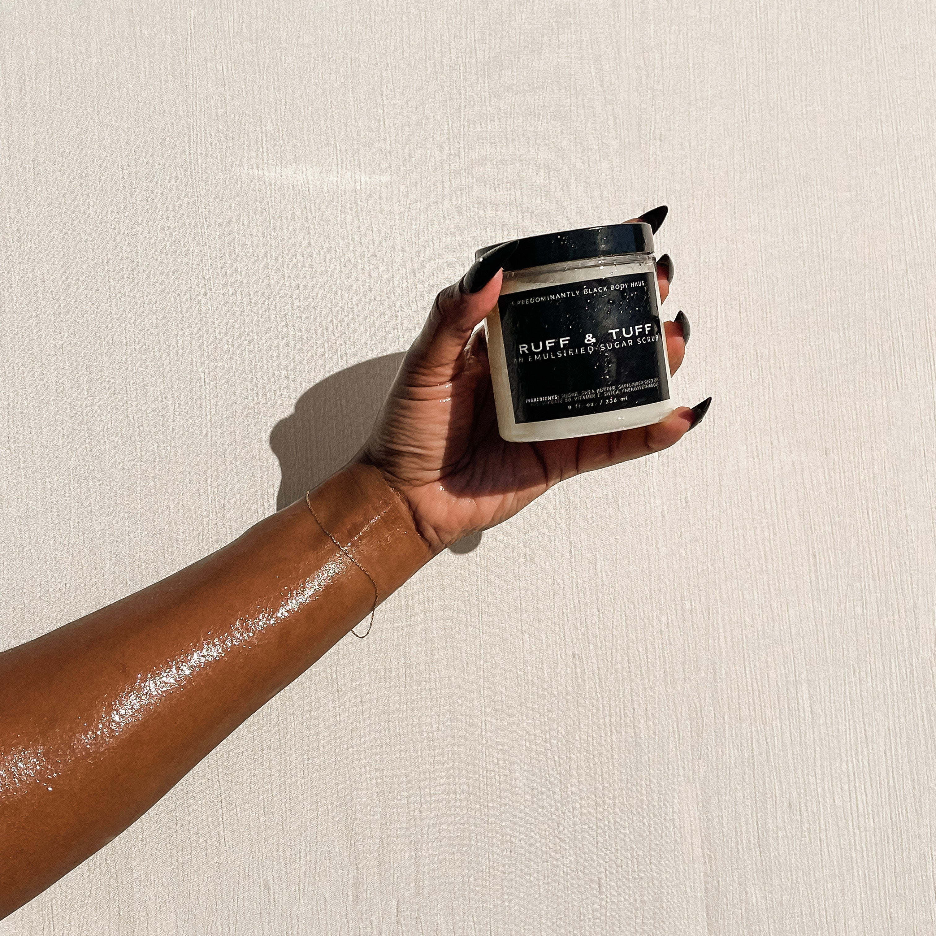 RUFF & TUFF sugar scrub applied to hand by Predominantly Black