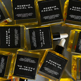 ROSEHIP FACIAL OIL bottles grouped together — Predominantly Black